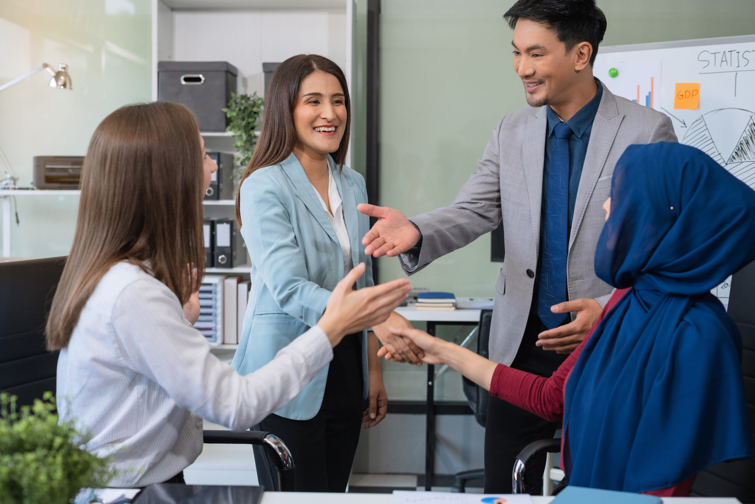 business people working as a good team in the office. Successful business people working as a good team in the office. Successful teamwork in a meeting, workplace concept.